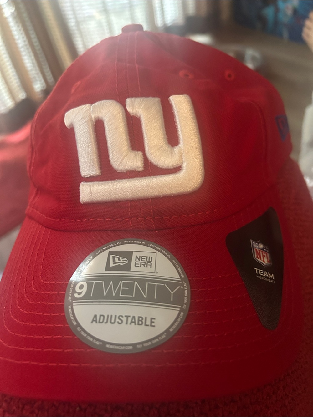 Cardinal red baseball cap with New York Giants logo